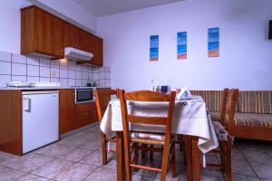 A kitchen or kitchenette at Roula Apartments