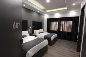 Postel nebo postele na pokoji v ubytování Hotel San Fernando Real
