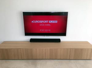 A television and/or entertainment centre at Villa las Colinas Golf Resort