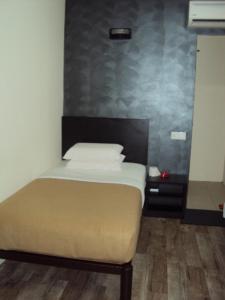 Cama o camas de una habitación en Tai Pan Hotel