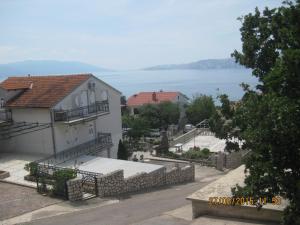 a building with a view of the water at Apartment Jovanović in Novi Vinodolski +4 photos