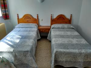 Postel nebo postele na pokoji v ubytování Pensión Rural Arroyo la Teja