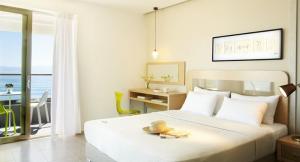 Posteľ alebo postele v izbe v ubytovaní Margarita Sea Side Hotel