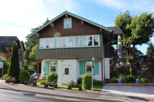 a house on the side of the street at Ferienwohnung Villa Parkblick in Oberhof
