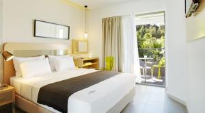 Posteľ alebo postele v izbe v ubytovaní Margarita Sea Side Hotel