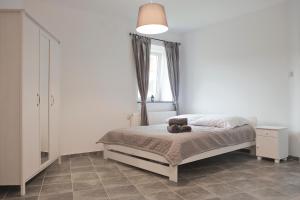Postel nebo postele na pokoji v ubytování Apartamenty w Starym Browarze 3