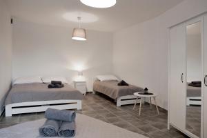 Postel nebo postele na pokoji v ubytování Apartamenty w Starym Browarze 3