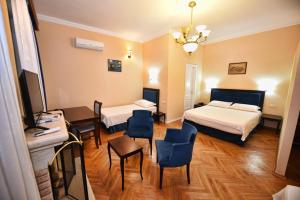 Ένα ή περισσότερα κρεβάτια σε δωμάτιο στο Rose Garden Hotel