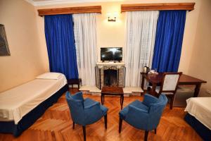Ένα ή περισσότερα κρεβάτια σε δωμάτιο στο Rose Garden Hotel