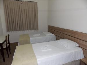 Postel nebo postele na pokoji v ubytování Hotel Mattes