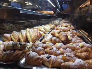 a display case in a bakery filled with lots of pastries at La Sosta Motel Tavola Calda in Matera