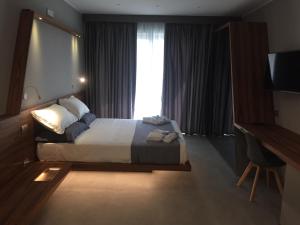 A bed or beds in a room at B&B Rakel Home