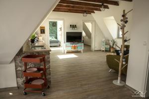 a large living room with a staircase and a living room at TeigenHeim in Rüdesheim am Rhein