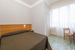 Postel nebo postele na pokoji v ubytování Albergo Battelli Only Adults
