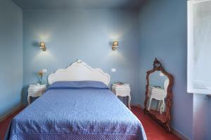 Postel nebo postele na pokoji v ubytování La Bellavita B&B