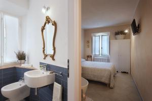 Koupelna v ubytování La Bellavita B&B + 37 fotografií