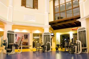 a gym with rows of treadmills and machines at Delfi Hotel Spa & Wellness Center in Bodrum City