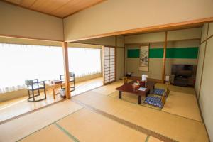 an inside view of a room with a table at Hotel Green Hill Kagoshima in Satsumasendai