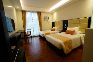 TV a/nebo společenská místnost v ubytování Hotel Oazis
