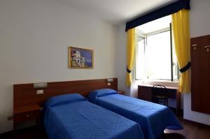 Postel nebo postele na pokoji v ubytování Hotel Tex + 29 fotografií