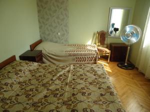 Postel nebo postele na pokoji v ubytování Guest House Lviv Грузия