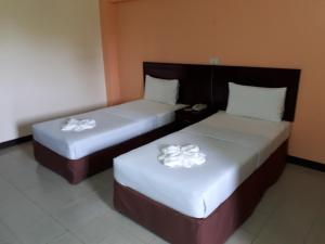 Postel nebo postele na pokoji v ubytování Centerpoint Hotel