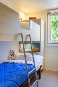 Postel nebo postele na pokoji v ubytování Camping Piantelle
