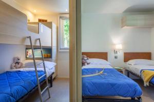 Postel nebo postele na pokoji v ubytování Camping Piantelle