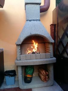 a brick oven with a fire in it at Sea Side in Constanţa