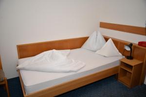 Postel nebo postele na pokoji v ubytování Hotel Öhlerhof