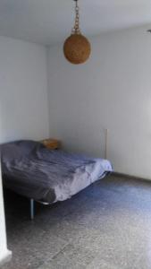 Un pat sau paturi într-o cameră la Pensíon24Todo