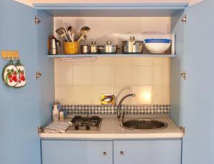 a kitchen with a sink and a counter top at Le Mànnare Case Vacanze di Metopa srl in Piano Conte +73 photos