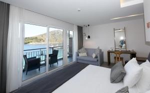 Postel nebo postele na pokoji v ubytování Minoa Hotel