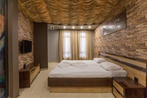 Letto o letti in una camera di Green Palace Hotel