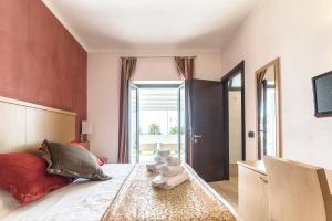 Postel nebo postele na pokoji v ubytování Hotel Tenda Rossa