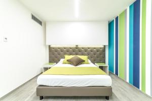 Postel nebo postele na pokoji v ubytování Hotel Tenda Rossa