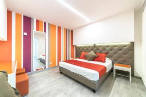Postel nebo postele na pokoji v ubytování Hotel Tenda Rossa