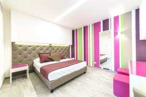Postel nebo postele na pokoji v ubytování Hotel Tenda Rossa