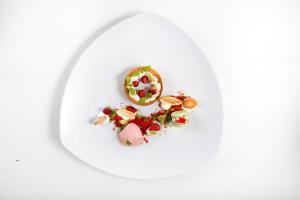 a plate of food with a donut on it at Hotel Villa Gabrisa in Positano