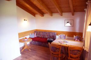 a living room with a couch and a table at Ferienwohnungen Mueller in Oberstdorf