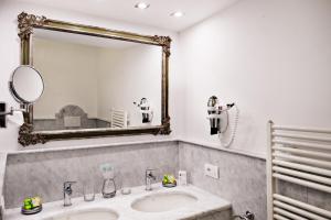 a bathroom with a sink and a mirror at Hotel Villa Gabrisa in Positano