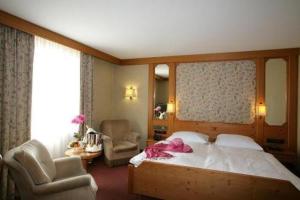 Postel nebo postele na pokoji v ubytování Hotel-Restaurant Arneggers Adler