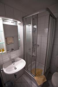 Koupelna v ubytování Hotel Maxim