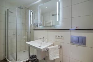 Koupelna v ubytování Hotel Maxim