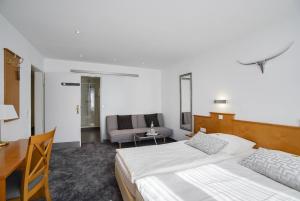 Postel nebo postele na pokoji v ubytování Hotel Maxim