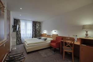 Postel nebo postele na pokoji v ubytování Hotel Maxim