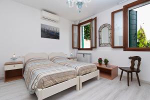 Un pat sau paturi într-o cameră la Ca' Del Pomo Grana' Al Roman