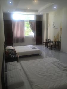 Postel nebo postele na pokoji v ubytování Phong Lan Guesthouse