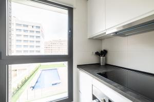 Kuchyňa alebo kuchynka v ubytovaní La Serna Premium Center