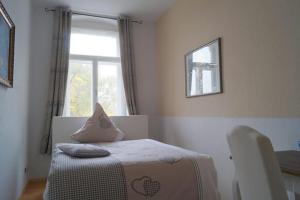 Ein Bett oder Betten in einem Zimmer der Unterkunft Ferienwohnung Schlossblick Altenburg